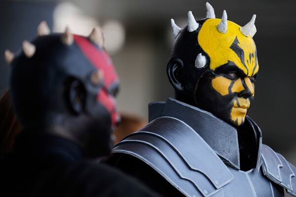 Star Wars fans wearing costumes of Darth Maul, left, and his brother Savage Opress pose for a photo outside the venue during a fan convention called the Star Wars Celebration in Chiba, near Tokyo, Friday, April 18, 2025. (AP Photo/Hiro Komae)