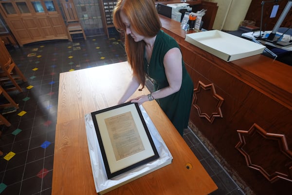 The 1865 Juneteenth General Order No. 3 is displayed by Kaitlyn Price, curator of collections for the Dallas Historical Society, at the Fair Park Hall of State, in Dallas, Friday, June 6, 2025. (AP Photo/LM Otero)