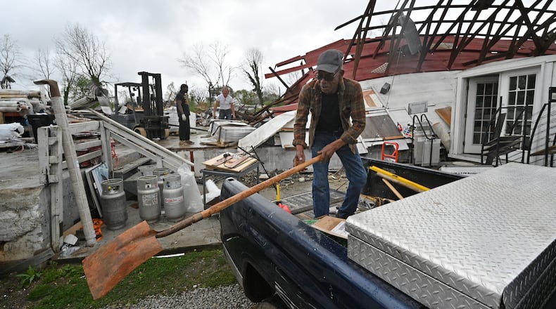 March 27, 2021 Newnan - Workers clean up destructed store at Mr. Carpet on Spence Avenue in the aftermath of the tornado that tore through the Newnan on Saturday, March 27, 2021. Storms that rolled through North Georgia late Thursday into Friday left a path of destruction, killing one person and injuring others. Most of metro Atlanta was spared from major damage, but Bartow and Polk counties - in northwest Georgia - and Coweta County south of Atlanta took the brunt of the impact. Late Friday, the National Weather Service said it was an EF4 tornado with 170-mph winds that hit Coweta. (Hyosub Shin / Hyosub.Shin@ajc.com)