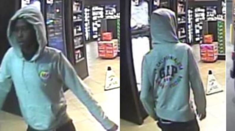 Surveillance video shows the man and vehicle being sought by police in connection with a robbery and carjacking in Lawrenceville. (Credit: Gwinnett County Police Department)