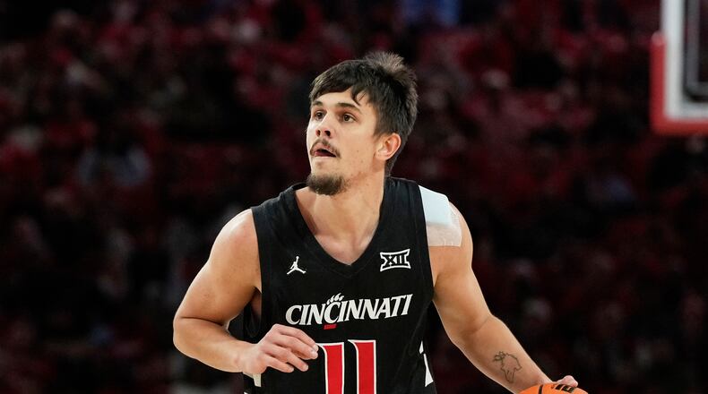 FILE - Cincinnati guard Kerr Kriisa (11) handles the ball during the first half of an NCAA college basketball game against Houston, Saturday, Jan. 31, 2026, in Houston. (AP Photo/Kevin M. Cox, File)