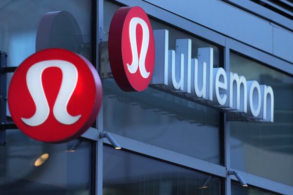 FILE - Lululemon signs are displayed outside a retail location in the Seaport District, Dec. 13, 2024, in Boston. (AP Photo/Charles Krupa, File)