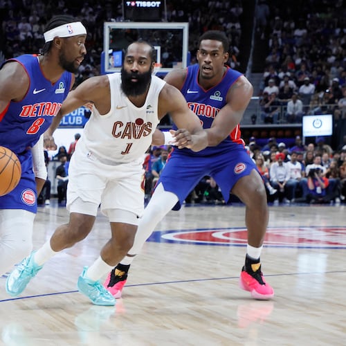 Detroit Pistons guard Caris LeVert (8) drives to the basket against Cleveland Cavaliers guard James Harden (1) with Pistons center Jalen Duren, right, helping on the play during the first half in Game 7 of a second-round NBA playoffs basketball series Sunday, May 17, 2026, in Detroit. (AP Photo/Duane Burleson)