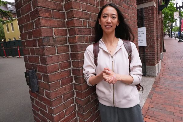 Yurong "Luanna" Jiang, who delivered a speech at her Harvard University commencement, poses at a gate to Harvard Yard, Friday, May 30, 2025, in Cambridge, Mass. (AP Photo/Charles Krupa)