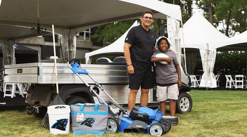 Carolina Panthers coach dropped in on 12-year-old Jalyin Clyburn with a brand-new lawnmower.