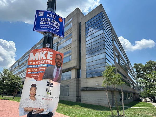 Campaign signs for Ward 8 city council candidates are displayed outside a District of Columbia government building in southeast Washington, Wednesday, July 9, 2025. (AP Photo/Robert Yoon)