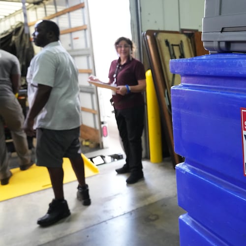 Employees prepare voting equipment at the Miami-Dade Supervisor of Elections Training and Support Center warehouse to be transported to voting precincts in advance of the August 18 Florida primary election, Thursday, Aug. 13, 2026, in Doral, Fla. (AP Photo/Lynne Sladky)