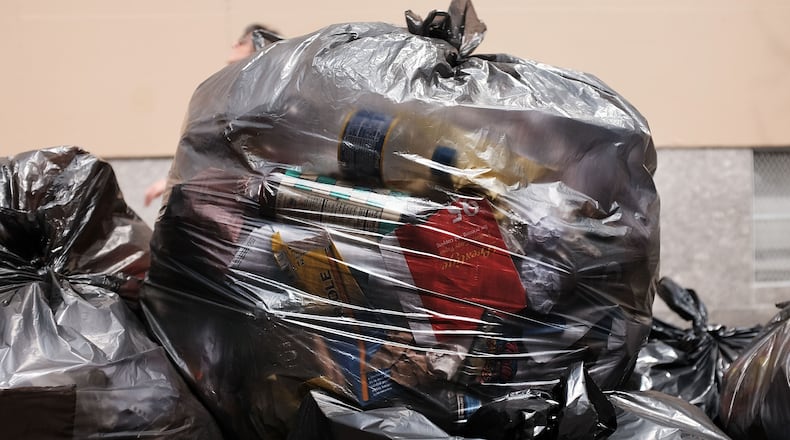 A New York woman is thankful to sanitation workers who found her wedding bands when she accidentally threw them away. (Photo by Spencer Platt/Getty Images)