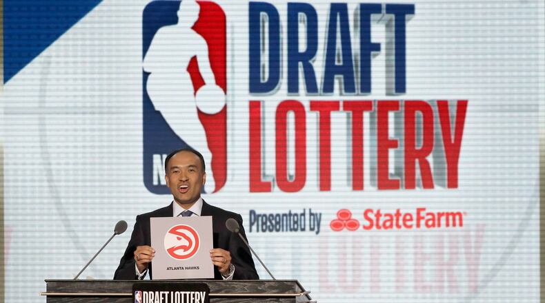 NBA Deputy Commissioner Mark Tatum announces the Atlanta Hawks won the third pick during the NBA basketball draft lottery on May 15, 2018, in Chicago. The Hawks currently have two first-round picks in next month’s NBA draft. (Charles Rex Arbogast/AP)