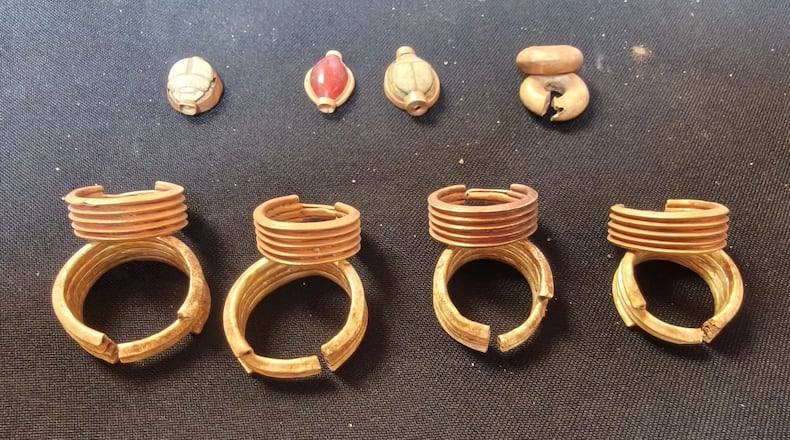 In this photo provided by Ministry of Tourism and Antiquities, recently unearthed ancient artifacts are displayed on May 31, 2026, in Ehnasiya district in Beni Suef, 130 kilometers (80 miles) south of Cairo, Egypt. (Ministry of Tourism and Antiquities via AP)