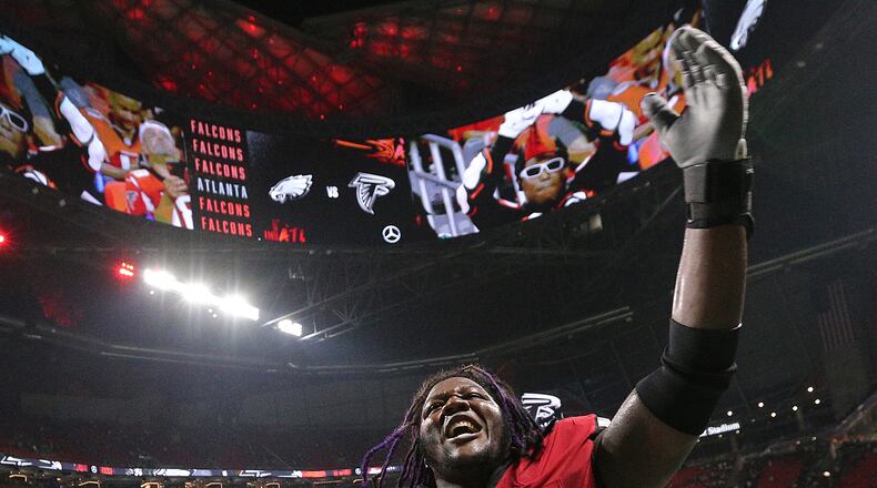 Falcons guard Jamon Brown celebrates a 24-20 victory over the Philadelphia Eagles.  Curtis Compton/ccompton@ajc.com