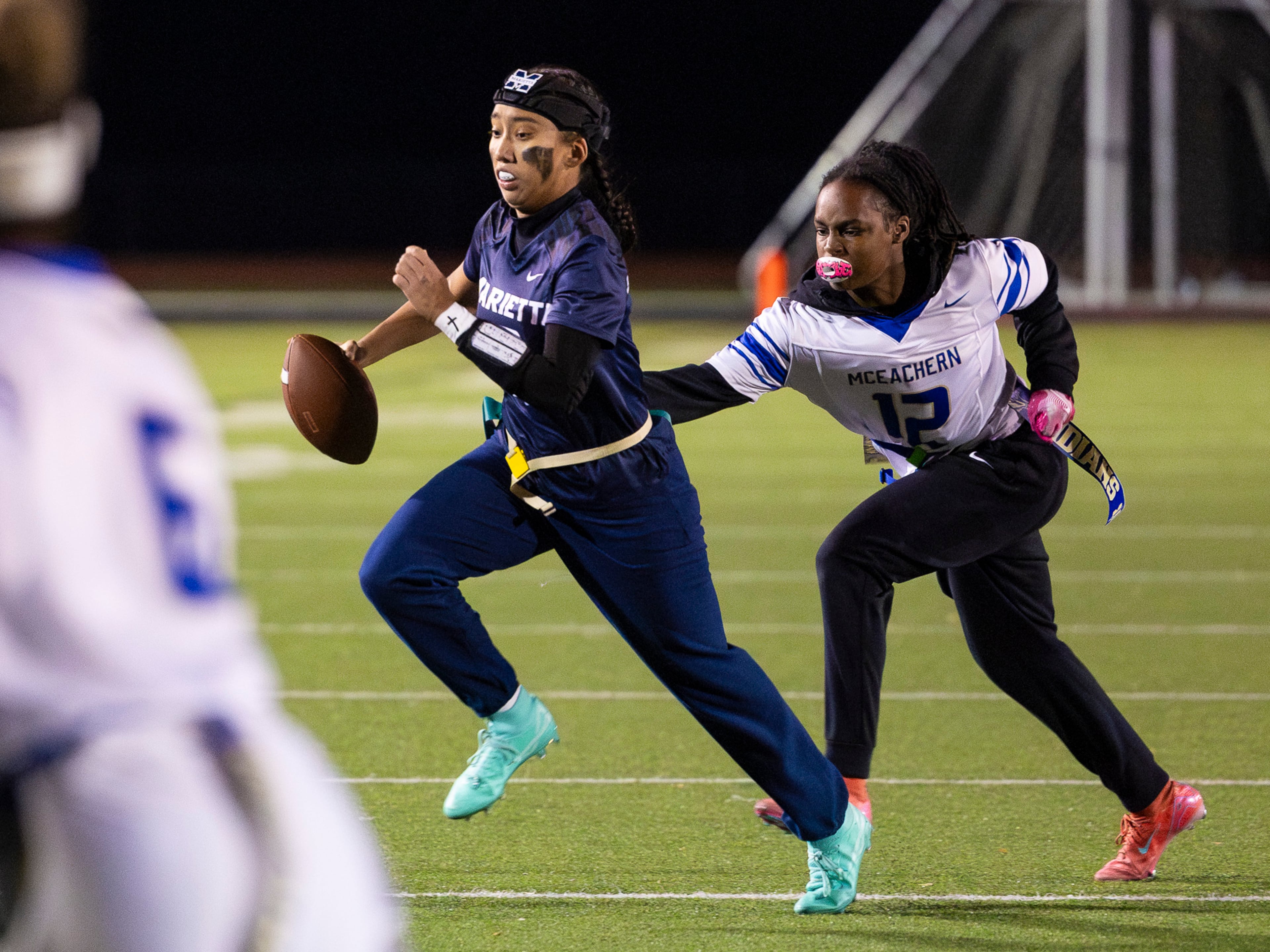 Marietta's Kaylee Wang (13) runs with the ball in a flag football game against McEachern at Osborne High School in Marietta, GA on Monday, November 17th, 2025. (Oscar Guevara Saenz for the AJC)