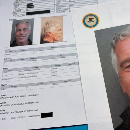 FILE - Documents that were included in the U.S. Department of Justice release of the Jeffrey Epstein files are photographed on Jan. 2, 2026. (AP Photo/Jon Elswick, File)