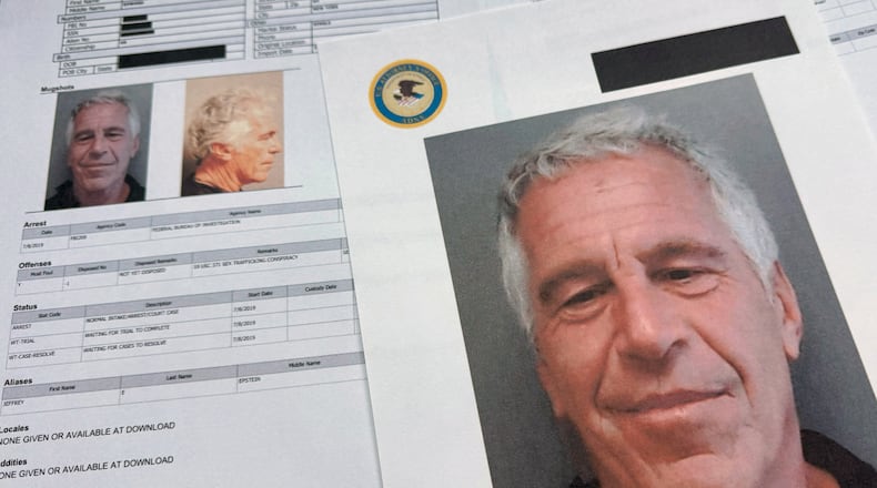 FILE - Documents that were included in the U.S. Department of Justice release of the Jeffrey Epstein files are photographed on Jan. 2, 2026. (AP Photo/Jon Elswick, File)