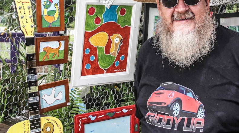 Charlie Dingler of Clayton, known for his boldly painted yard art, credits the Viral Art Facebook page with supporting him throughout a summer of canceled folk art festivals due to COVID-19. 
Courtesy of Robert White