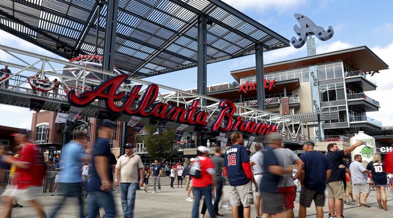 Braves fans enjoy The Battery Atlanta before a playoff game last October. The Braves have spent a lot of money developing the mixed-use complex adjacent to their stadium.