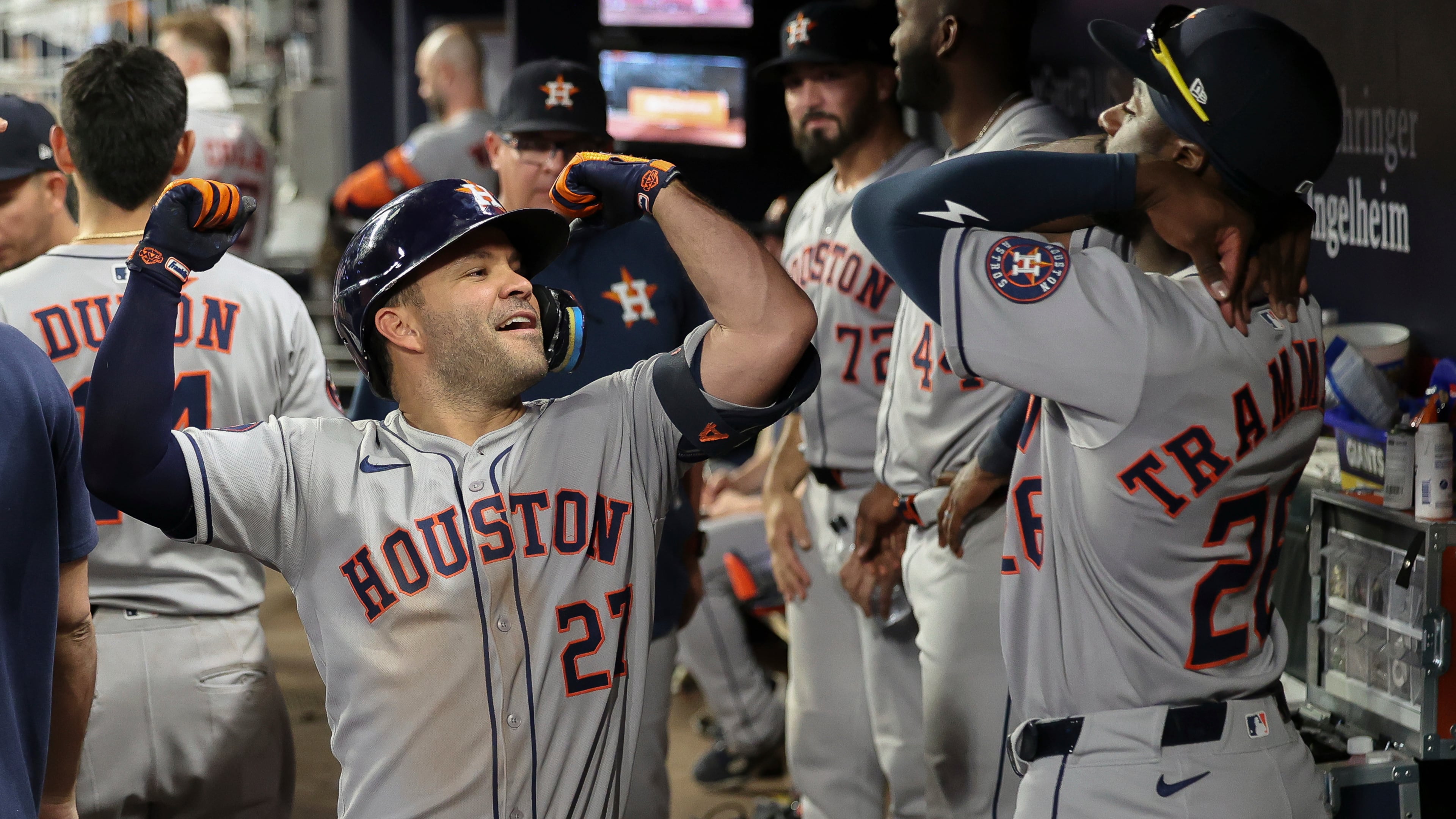 Houston Astros' Jose Altuve, left, flexes in the dugout after hitting a solo home run in the sixth inning of a baseball game against the Atlanta Braves, Friday, Sept. 12, 2025, in Atlanta. (AP Photo/Colin Hubbard)