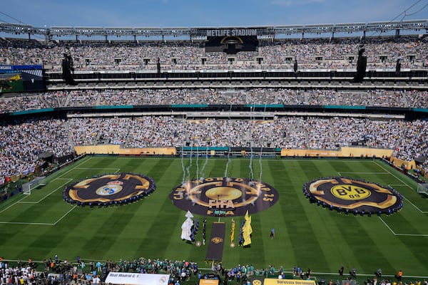 Players line up prior to the Club World Cup quarterfinal soccer match between Real Madrid and Borussia Dortmund in East Rutherford, N.J., Saturday, July 5, 2025. (AP Photo/Pamela Smith)