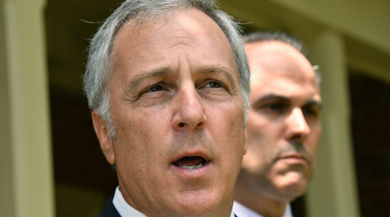 May 14, 2020 Decatur - Robert G. Rubin (left) and Jason B. Sheffield, lawyers for Travis and Gregory McMichael, speak to members of the press outside their office in Decatur on Thursday, May 14, 2020. The attorneys representing Travis McMichael, charged with murder in the death of Ahmaud Arbery, said they are committed to finding the truth in the case. (Hyosub Shin / Hyosub.Shin@ajc.com)