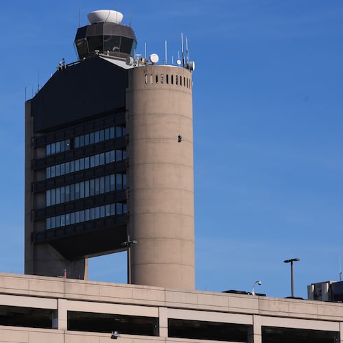 FILE - The control tower at Logan Airport, on Dec. 9, 2025, in Boston. (AP Photo/Charles Krupa, File)