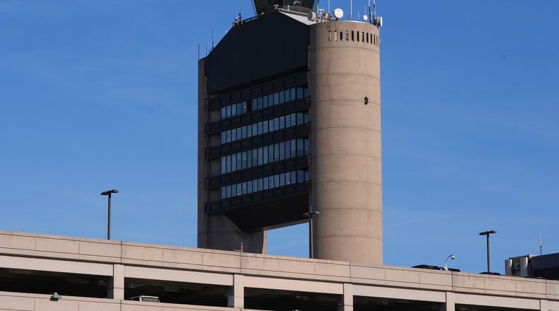 FILE - The control tower at Logan Airport, on Dec. 9, 2025, in Boston. (AP Photo/Charles Krupa, File)