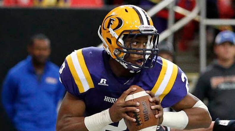 Fitzgerald quarterback James Graham and the No. 3 Purple Hurricane travel to Atlanta to take on No. 2 Hapeville Charter on Friday in the season opener for both teams. (Jason Getz/For the AJC)