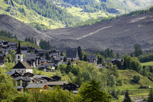 A massive debris avalanche, with the village of Kippel in the foreground, is seen on Thursday, May 29, 2025, one day after the collapse of the Birch Glacier causing the demolishing of the village of Blatten in Switzerland. (Jean-Christophe Bott/Keystone via AP)