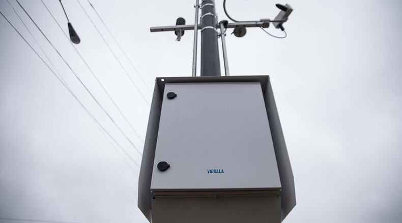 12/23/2019 — Atlanta, Georgia — A Road Weather Information System sensor is mounted on a pole along North Druid Hills Road NE in Atlanta, Monday, December 23, 2019. The city of Brookhaven is, to its knowledge, the first government to partner with Georgia DOT to install a Road Weather Information System sensor. The device, installed at the intersection of Buford Highway and North Druid Hills Road, can provide real-time data on weather factors including pavement conditions, precipitation amounts and visibility. (ALYSSA POINTER/ALYSSA.POINTER@AJC.COM)