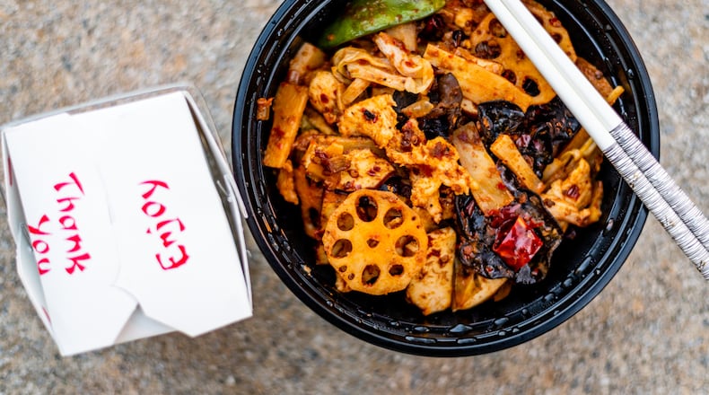 The spicy chicken hot pot from Urban Wu is perfect for warming up during chilly winter weather. Henri Hollis for The Atlanta Journal-Constitution.