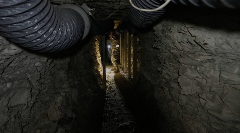 FILE - Lebanese army soldiers walk through a tunnel dug into a mountain that was used by Hezbollah militants as a clinic and storage facility near the Lebanese-Israeli border in the Zibqin Valley, southern Lebanon, Nov. 28, 2025. (AP Photo/Bilal Hussein, File)