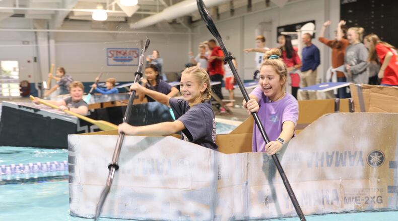 Students at Simpson Middle School test the Cardboard Regatta, which required students to use STEAM components to design the boats.