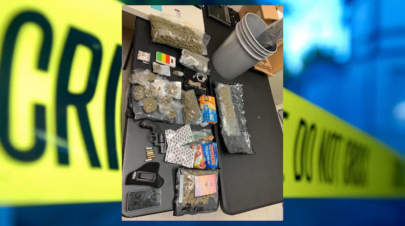 During a traffic stop over the weekend, a Rockdale County sheriff's deputy found a stolen gun, drugs and drug-laced candy, according to authorities.