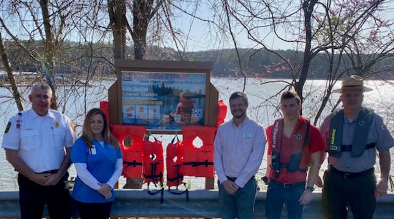 Cherokee County's new life jacket loaner station will serve as a potentially lifesaving reminder to local boaters. Pictured L to R: Chief Chad Arp, Fire Marshal, Community Risk Reduction Division, Cherokee County Fire and Emergency Services; Lisa Grisham, Safe Kids Cherokee County Coordinator, Community Risk Reduction Division, Cherokee County Fire and Emergency Services; Jordan Wood, Parks Division Director, Cherokee Recreation and Parks; Hunter Baird, Captain, Tow Boat U.S.; Chris Purvis, Lead Ranger, Allatoona Lake, U.S. Army Corps of Engineers. 
Photo credit - Tim Cavender