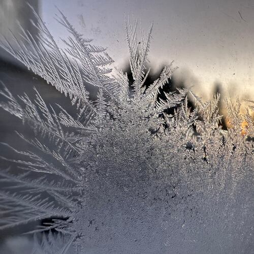 Ice crystals form inside a kitchen window in Lowville, New York, Saturday, Jan. 24, 2026. (AP Photo/Cara Anna)
