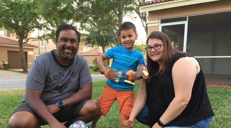 The Ramsaran family of Riviera Beach posing with Toy Story characters at their home after Disney World brought the magic to them.