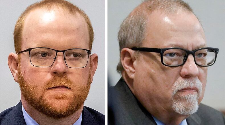 Travis McMichael (left) and his father Greg.