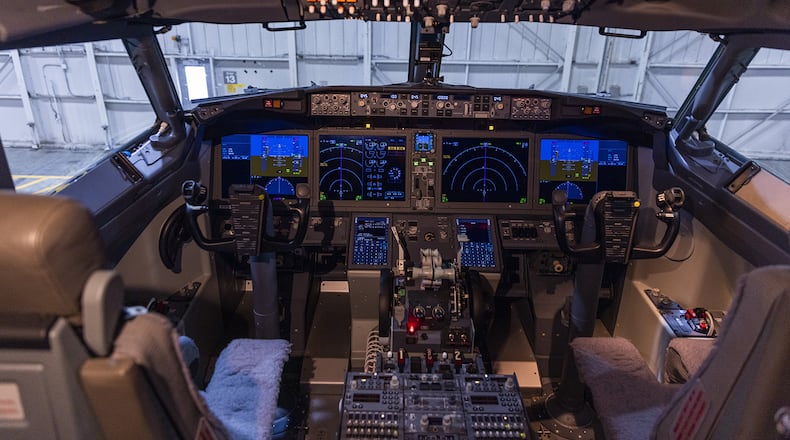 The control board lights up in the Boeing ecoDemonstrator cockpit in a hanger at Boeing Field on Sept. 27, 2021. (Daniel Kim/Seattle Times/TNS)