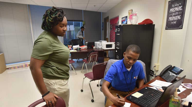 February 7, 2018 Atlanta - Valencia Dennis, student support coach, consults with Kyrsten Burch,18, during their Target 2021 program session at Maynard Jackson High School on Wednesday, Feb. 7, 2018. After a year and a half and $7.5 million, Atlanta Public Schools can show only mixed or inconclusive results for a program intended to support the student victims of a major cheating conspiracy. A recent evaluation of the Target 2021 program — named for the graduation year of the youngest Atlanta students caught up in the cheating conspiracy— shows scant evidence that the initiative is helping those children whose answers on standardized tests were changed by educators. HYOSUB SHIN / HSHIN@AJC.COM
