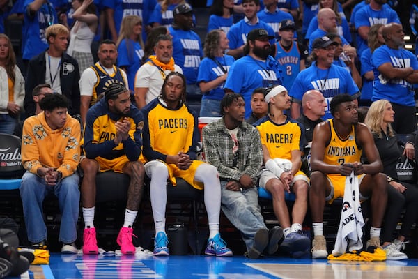 Indiana Pacers players sit on the bench during the second half of Game 2 of the NBA Finals basketball series against the Oklahoma City Thunder Sunday, June 8, 2025, in Oklahoma City. (AP Photo/Julio Cortez)