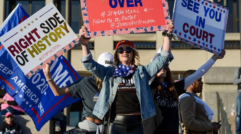 Supporters of President Donald Trump attend a rally near the White House in Washington, Nov. 14, 2020. Amazon, Apple and Google have cut off Parler, a social network that pitches itself as a “free speech” alternative to Twitter and Facebook.