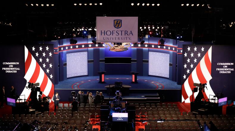 People wait in the hall for the presidential debate between Democratic presidential candidate Hillary Clinton and Republican presidential candidate Donald Trump at Hofstra University in Hempstead, N.Y., Monday, Sept. 26, 2016. (AP Photo/David Goldman)
