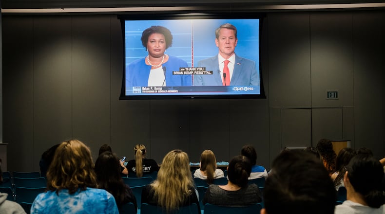 Students attend a watch party to see the gubernatorial debate between Democratic challenger Stacey Abrams, Libertarian challenger Shane Hazel and Georgia Republican Gov. Brian Kemp, at Emory University, Atlanta, on Oct. 17, 2022. (Gabriela Bhaskar/The New York Times)