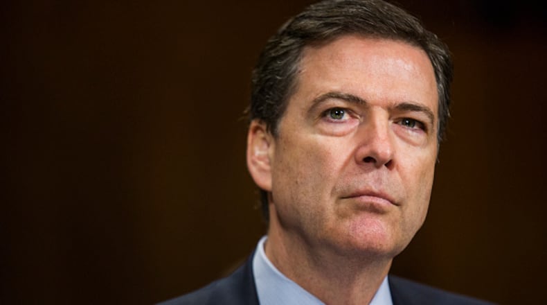 FBI Director James B. Comey is pictured here testifying in front of the Senate Judiciary Committee on Capitol Hill in Washington in May. Comey is writing a new memoir about his career and his stint with the Trump administration.