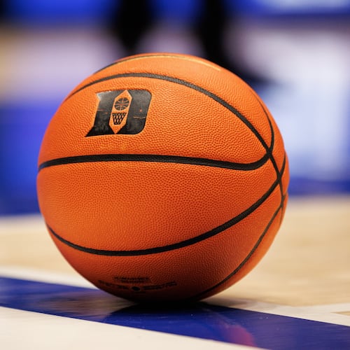 FILE - A basketball with the Duke logo sits on the court during a timeout in an NCAA college basketball game against in Durham, N.C., Dec. 16, 2025. (AP Photo/Ben McKeown, File)
