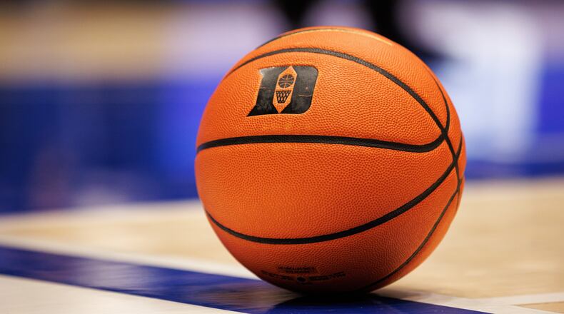 FILE - A basketball with the Duke logo sits on the court during a timeout in an NCAA college basketball game against in Durham, N.C., Dec. 16, 2025. (AP Photo/Ben McKeown, File)
