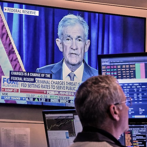 A video of Federal Reserve Chair Jerome Powell plays on a screen on the floor of the New York Stock Exchange, Monday, Jan. 12, 2026. (AP Photo/Richard Drew)