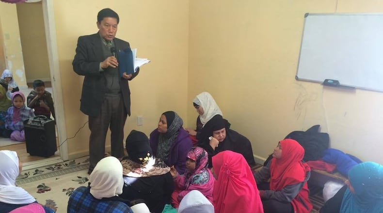 A representative of Georgia Refugee Health and Mental Health, based in Clarkston, speaks to a group about health care. (PHOTO courtesy of GRHMH)