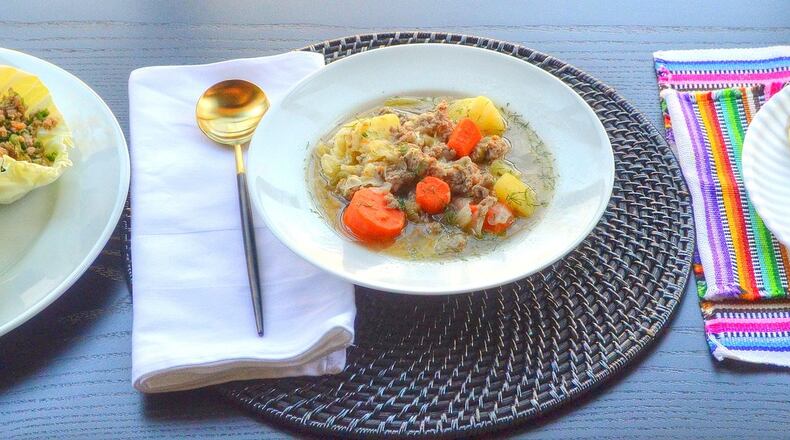 From left to right: Ground turkey with cabbage cups; Pork sausage, potato, cabbage and carrot soup; Shrimp tacos with serrano, cilantro and lime cabbage slaw. Photos taken Dec. 18, 2019, in Atlanta at the home of Jennifer Zyman. Food styling by Jennifer Zyman. (Photo by Chris Hunt Photography)
