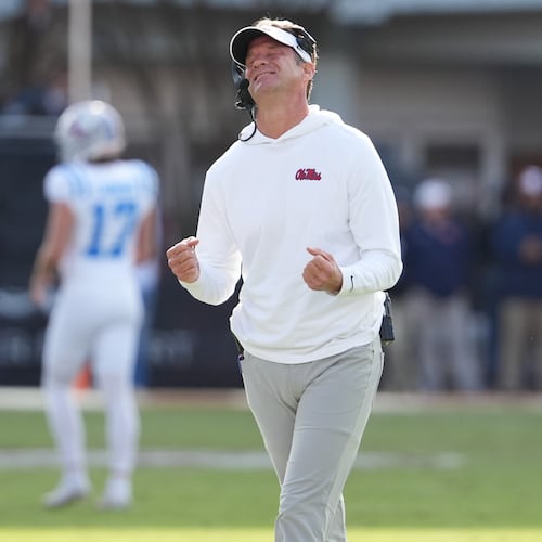 Mississippi head coach Lane Kiffin reacts to a official's call during the second half of an NCAA college football game against Mississippi State, Friday, Nov. 28, 2025, in Starkville, Miss. (AP Photo/Rogelio V. Solis)