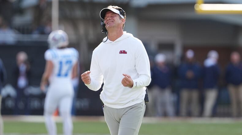 Mississippi head coach Lane Kiffin reacts to a official's call during the second half of an NCAA college football game against Mississippi State, Friday, Nov. 28, 2025, in Starkville, Miss. (AP Photo/Rogelio V. Solis)